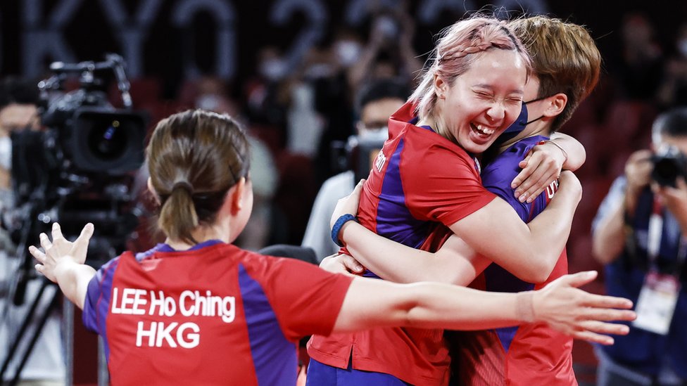 Lee Ho-ching Soo Wai Yam Minnie and Doo Hoi-kem of Hong Kong celebrate after winning the Table Tennis Women"s team bronze medal match against Germany in during at the Tokyo 2020 Olympic Games at the Tokyo Metropolitan Gymnasium arena in Tokyo, Japan, 05 August 2021.