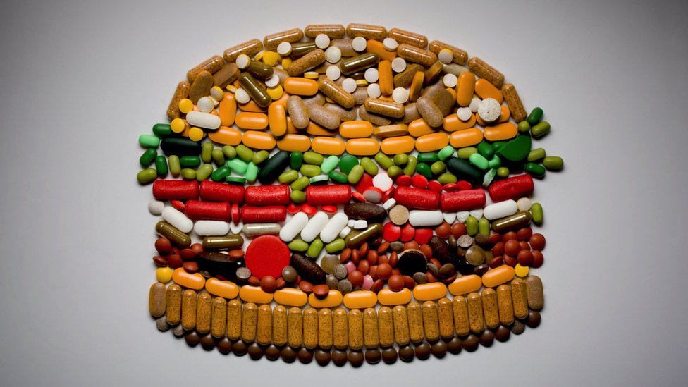 Concept image: a burger made up of pills and vitamins