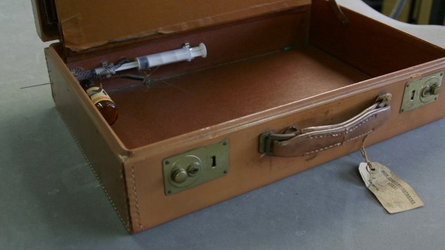 suitcase with built-in syringe