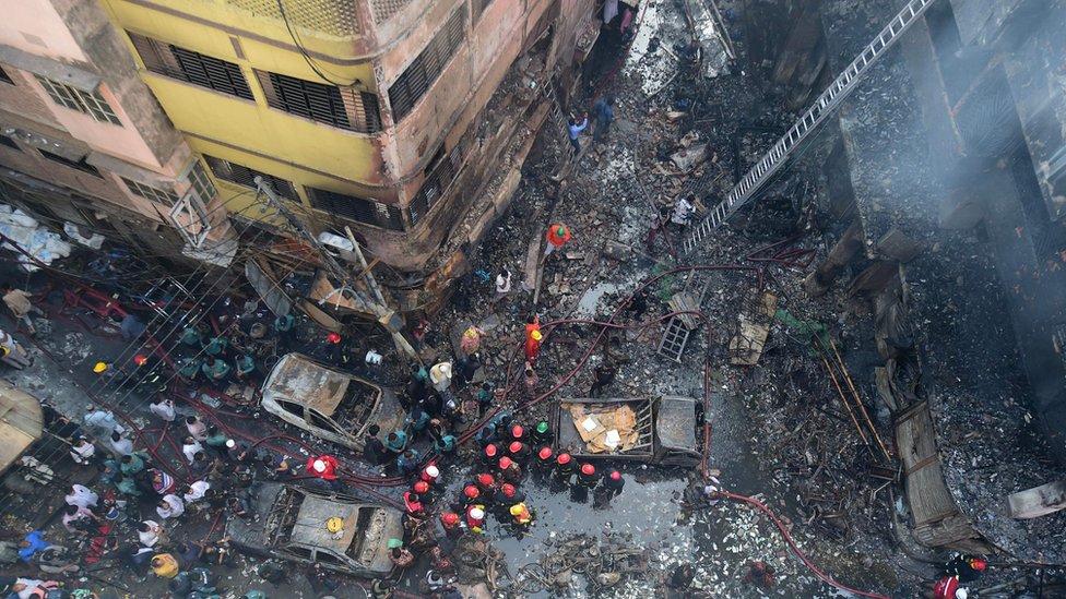 Firefighters are seen at the scene of a fire in Dhaka on February 21, 2019.