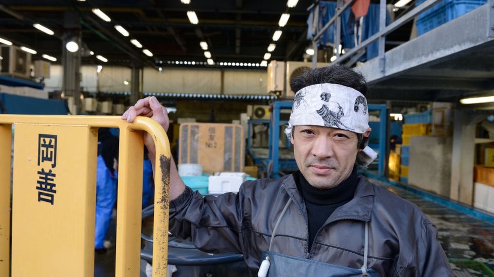 A vendor at Tsujiki market stands by a palette