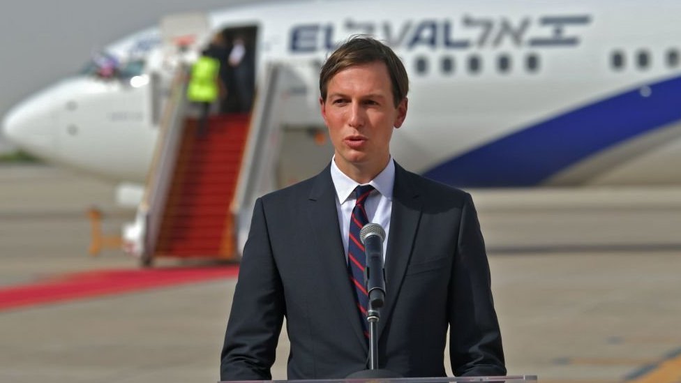 US Presidential Adviser Jared Kushner speaks in front of an air-plane of El Al at the Abu Dhabi airport