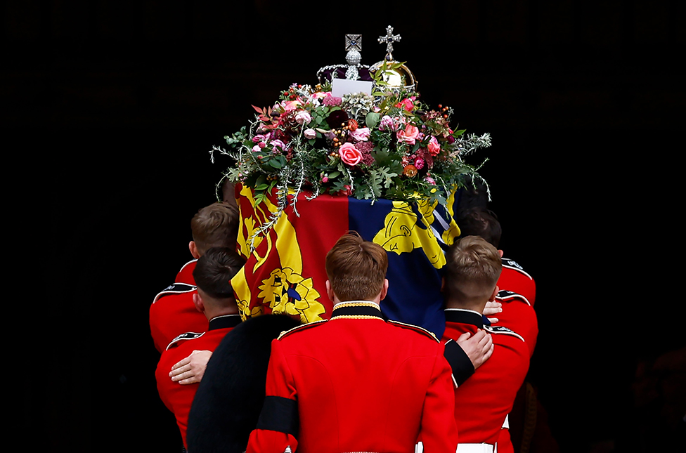 Pall bearers carry the coffin of Queen Elizabeth II into St. George's Chapel on September 19, 2022 in Windsor, England