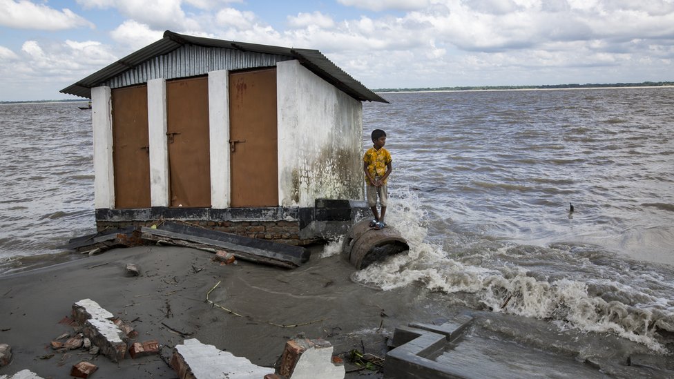 A boy who lost their belongings in river erosion takes shelter in a shelter home which is now eroded again.