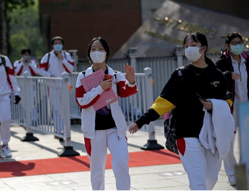 Students wearing face masks leave a school in Beijing, China as senior high school students in the Chinese capital returned to campus following the coronavirus disease (COVID-19) outbreak, April 27, 2020.