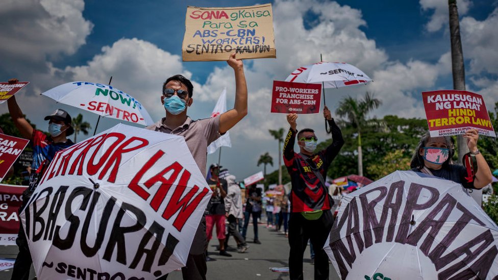 Protesters wearing facemasks take part in a protest against President Duterte on July 27, 2020 in Quezon city, Metro Manila, Philippines