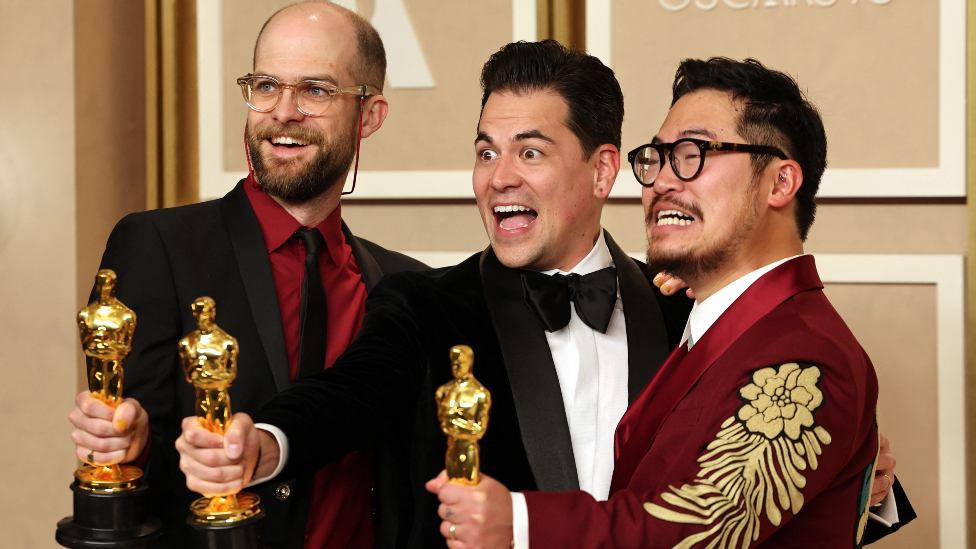 Daniel Kwan, Daniel Scheinert and Jonathan Wang pose with the Oscar for Best Picture for "Everything Everywhere All at Once" in the Oscars photo room at the 95th Academy Awards in Hollywood, Los Angeles, California