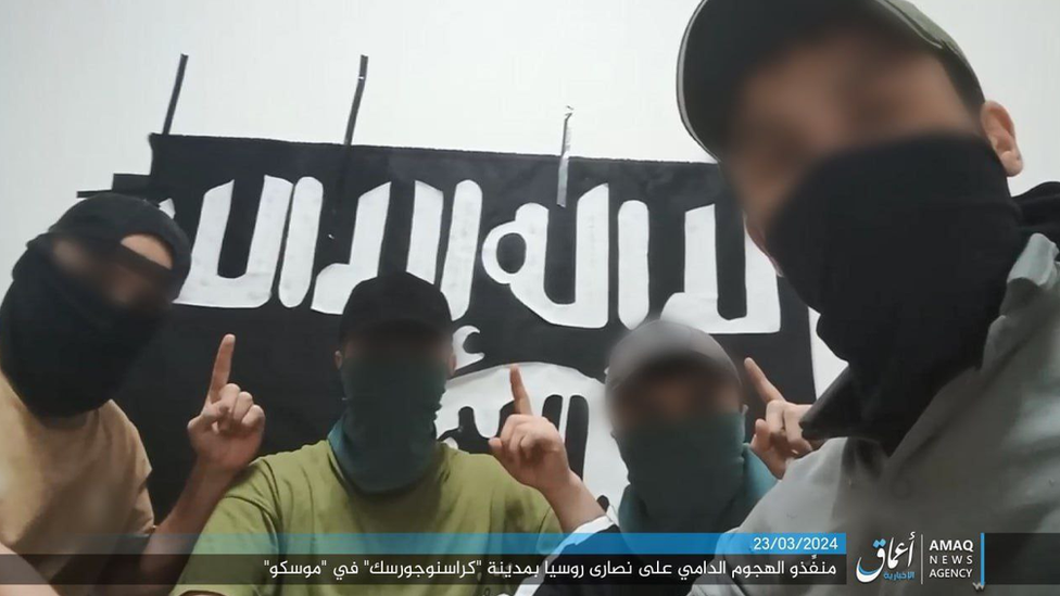 A screen shot of the IS video showing the four attackers with their faces blurred