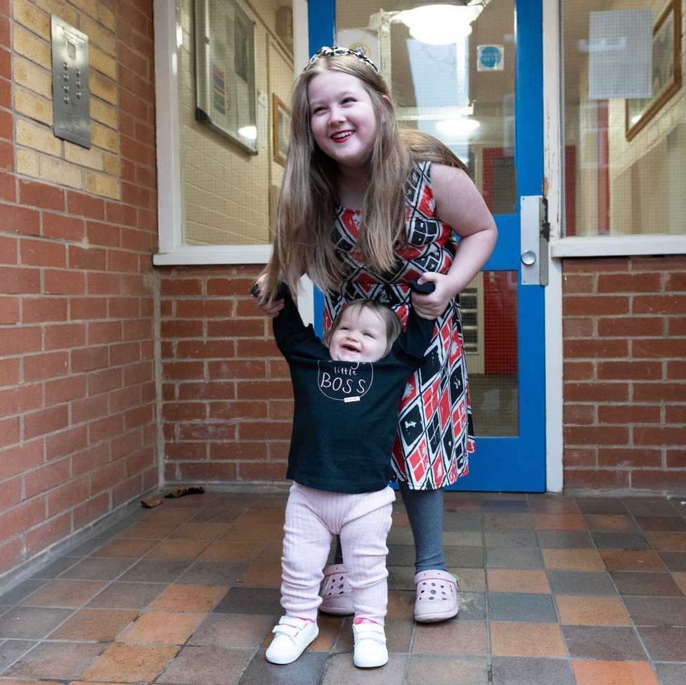 Annabelle and Jasmine-Rose on the doorstep of their home in Nottingham