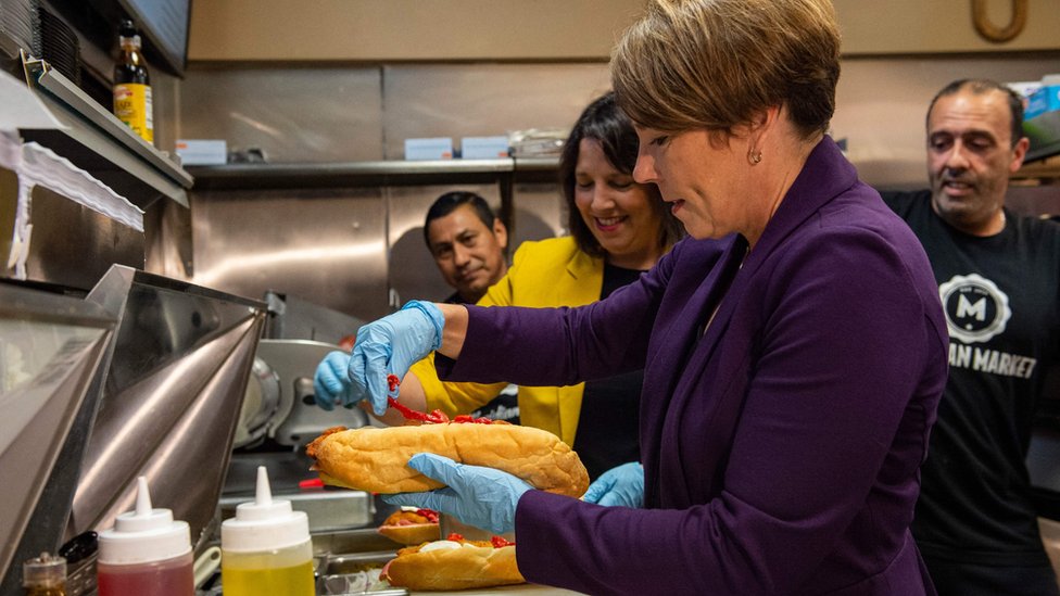 Maura Healey visits Meridian Street Market and makes an Italian Sub as she campaigns on the eve of the US midterm election, in Boston, Massachusetts, on 7 November 2022