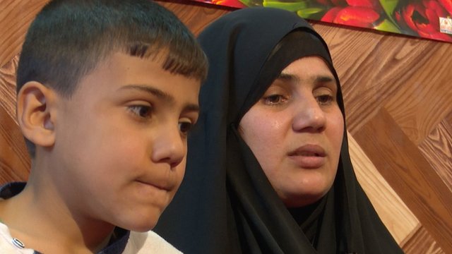 Om Hussein and her son