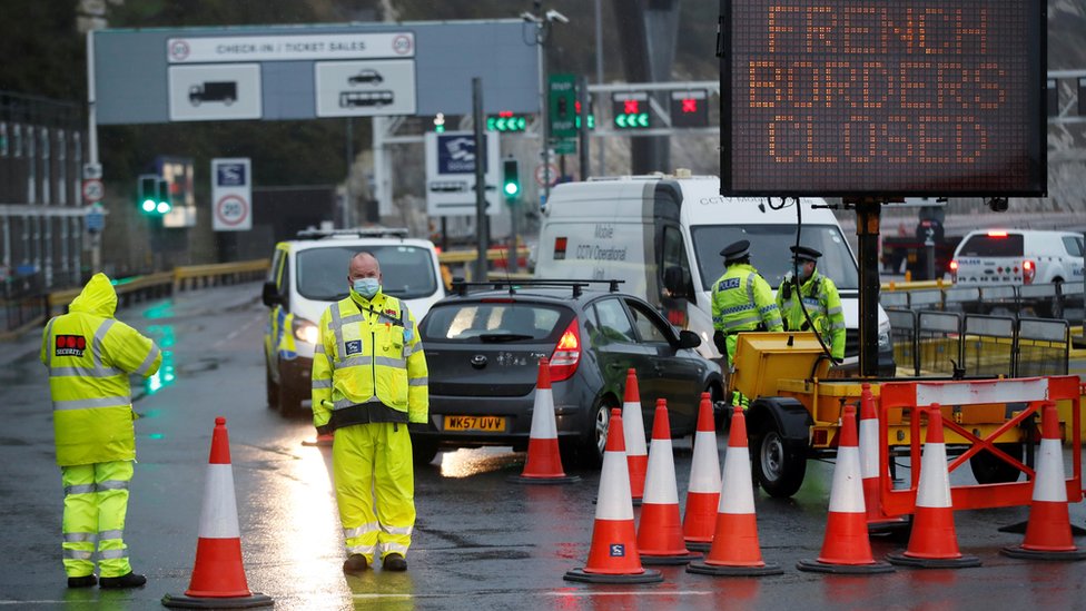 Security officers stand guard at an entrance of the Port of Dover