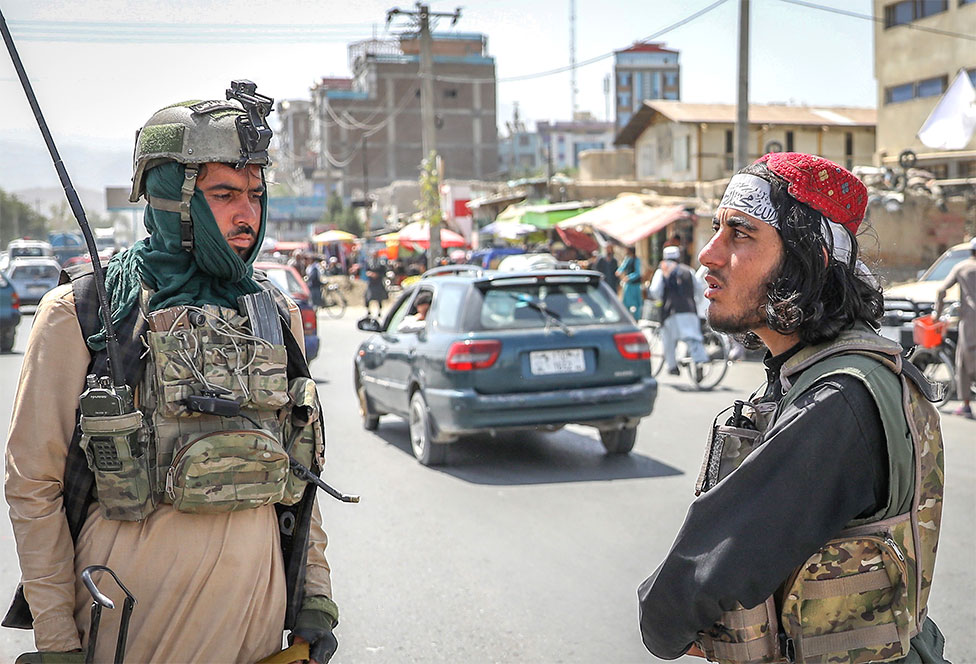 Members of the Taliban stand in a checkpoint in Kabul, Afghanistan, 16 August 2021