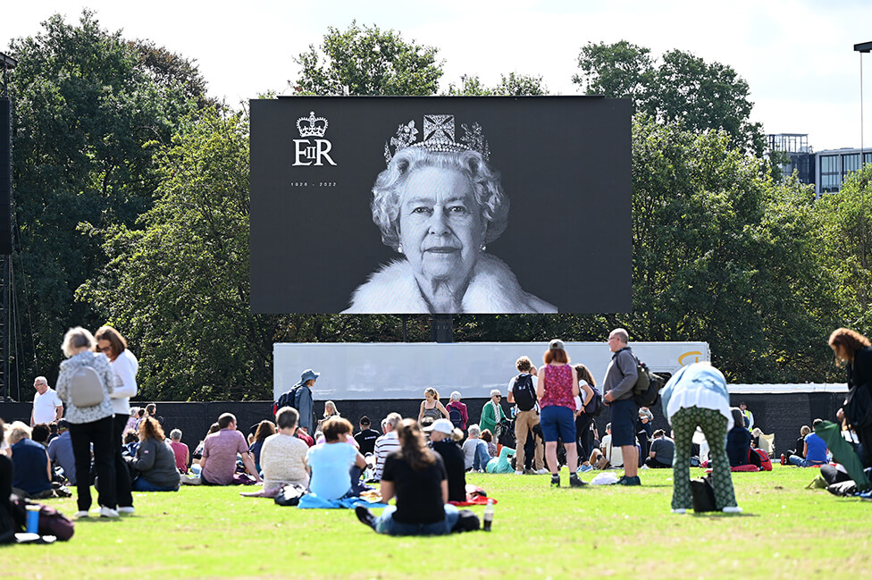 An image of Queen Elizabeth II is shown on a big screen in Hyde Park