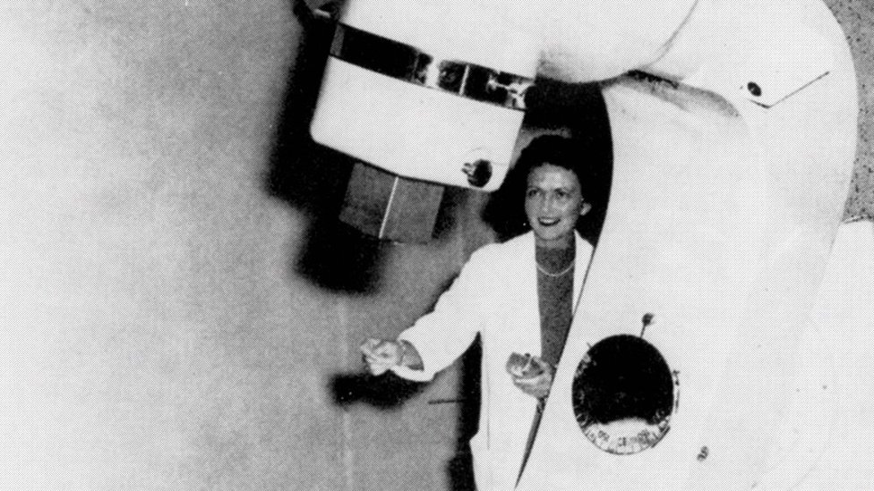 Dr Vera Peters pictured with the “Cobalt X-otron” bomb developed by scientific staff of the Ontario Cancer Institute, 1958