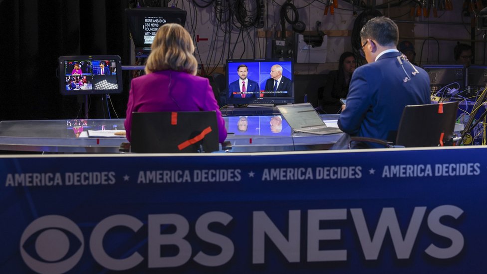 Members of the media watch the Vice Presidential debate between Republican vice presidential nominee JD Vance and Minnesota Governor and Democratic vice presidential nominee Tim Walz, in the spin room at the CBS Broadcast Center in New York, New York, USA, 01 October 2024.