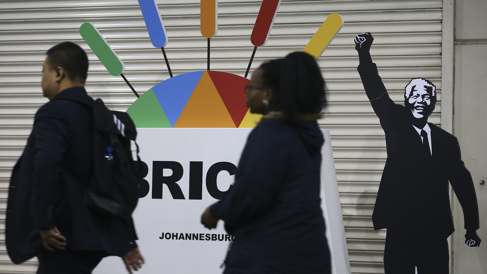 A Brics signboard and cut-out of Nelson Mandela at the summit venue in Johannesburg in July 2018
