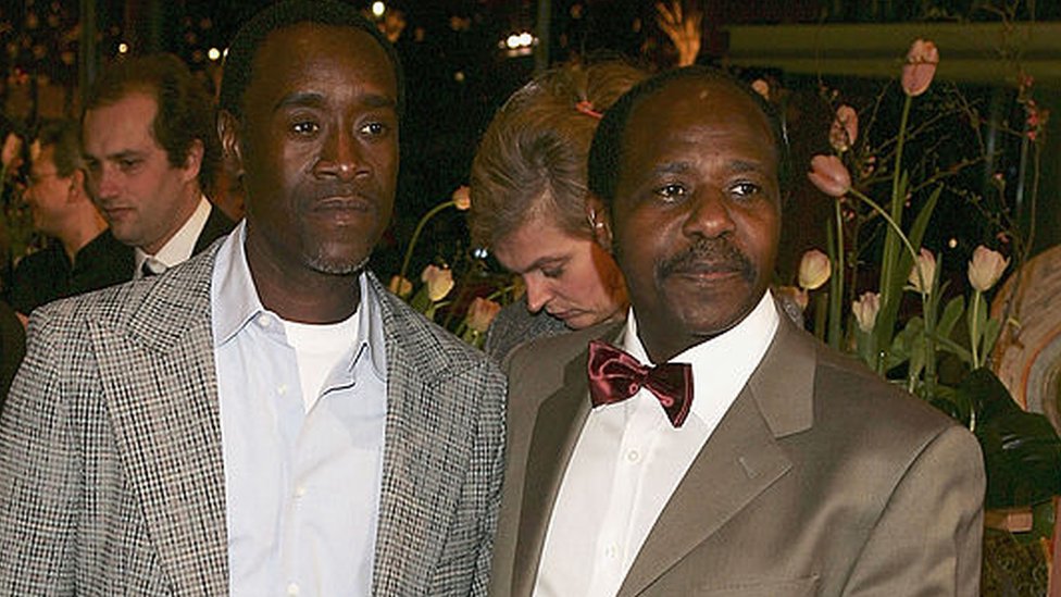 Actor Don Cheadle (L) and Paul Rusesabagina arrive at the "Hotel Rwanda" Premiere during the 55th annual Berlinale International Film Festival on February 11, 2005 in Berlin, Germany.