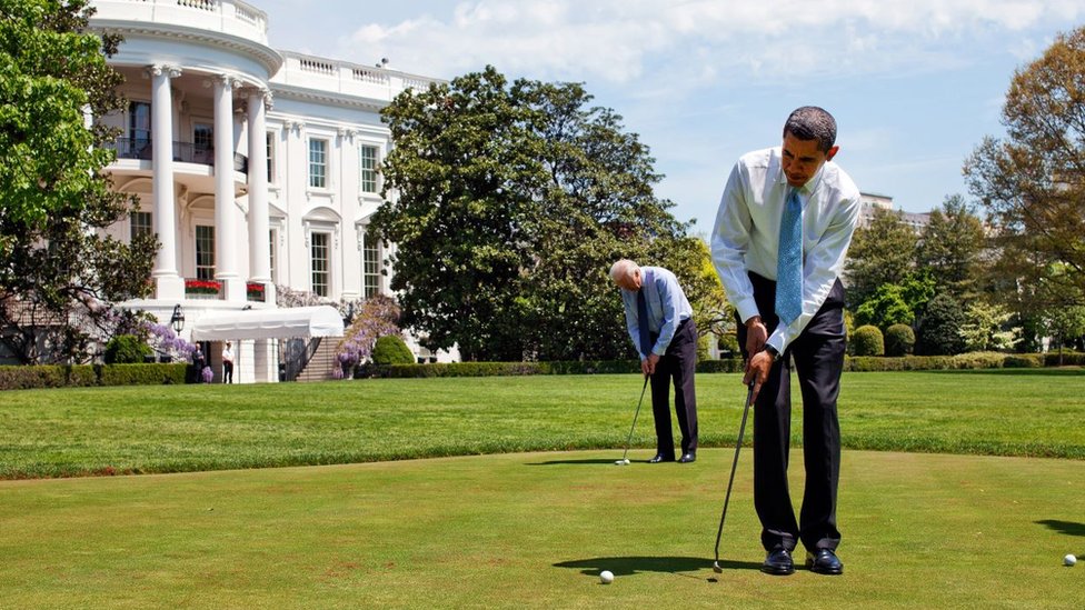 Barack Obama with Joe Biden playing golf outside the White House 