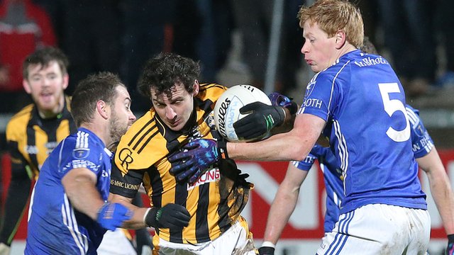 Scotstown pair Mark Duffy and Emmet Duffy tackle Crossmaglen forward Jamie Clarke