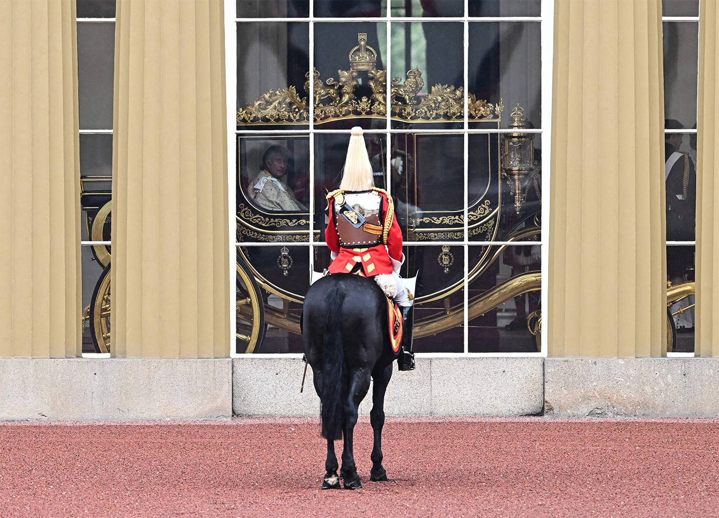 King Charles and Queen Camilla begin their journey from Buckingham Palace in the Diamond State Coach