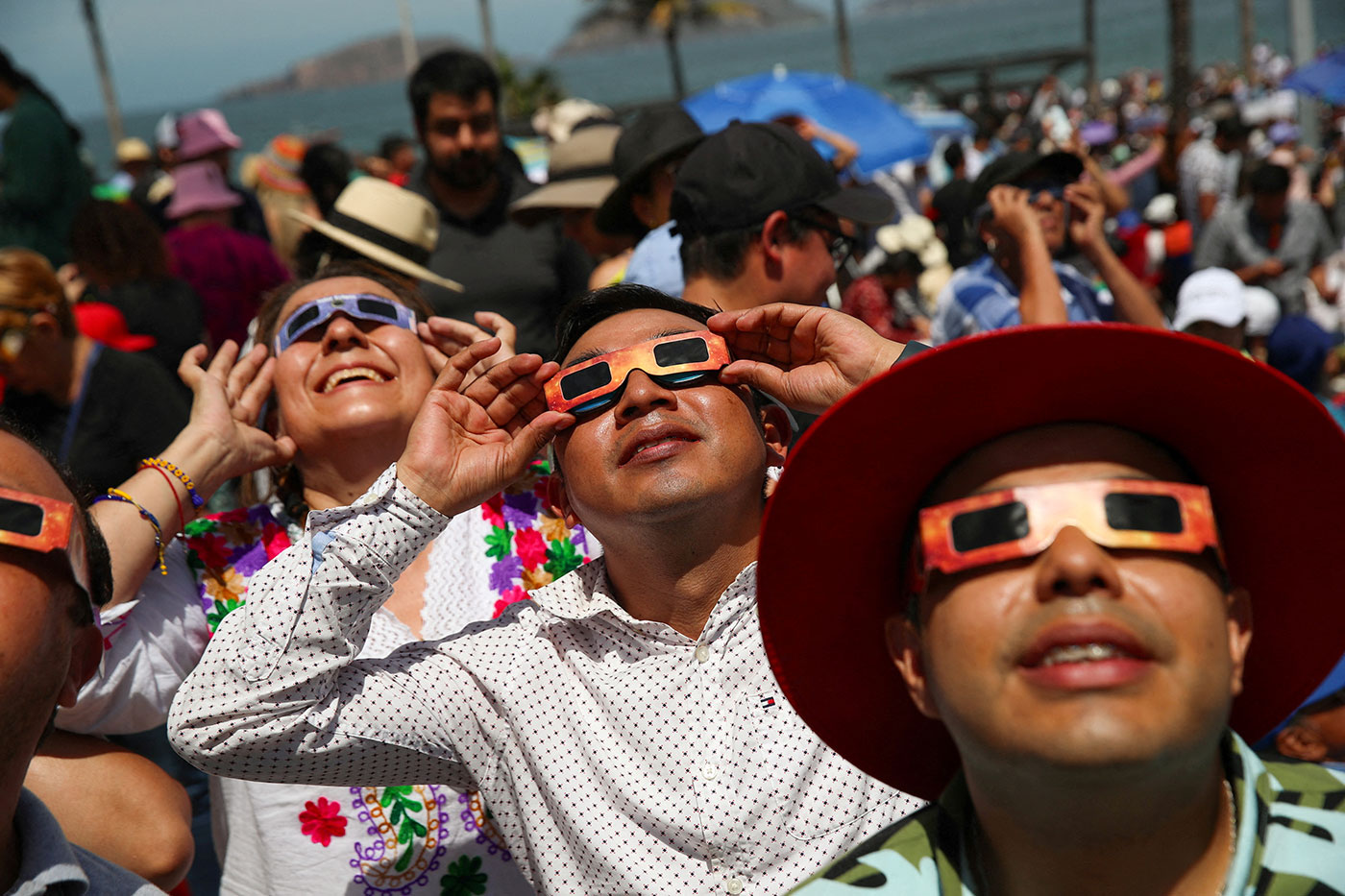 People use special protective glasses to observe a total solar eclipse in Mazatlan, Mexico - 8 April 2024 (Henry Romero/Reuters)