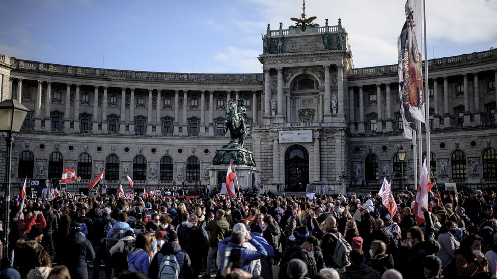 People take part in a demonstration against the measures of the Austrian government to slow down the ongoing pandemic of the COVID-19 disease caused by the SARS-CoV-2 coronavirus at the Heldenplatz square in Vienna, Austria, 20 November 2021. Austrian Chancellor Alexander Schallenberg announced a mandatory vaccination against the SARS-CoV-2 coronavirus by February 2022, and a general nationwide lockdown to stem the ongoing pandemic of COVID-19, starting from 22 November. EPA/CHRISTIAN BRUNA