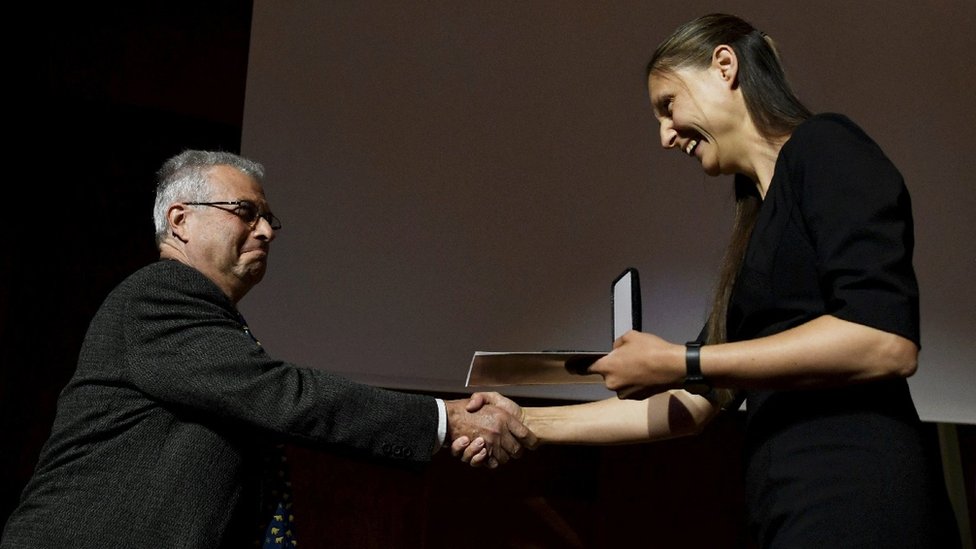 Maryna Viazovska receives the Fields Medals for Mathematics from International Mathematical Union (IMU) President Carlos E. Kenig during the award ceremony at the International Congress of Mathematicians 2022