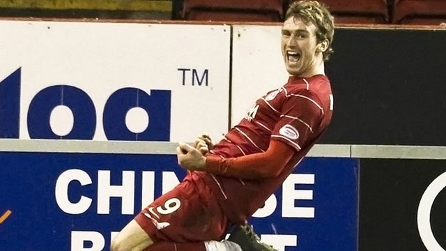 Lee Miller celebrates after scoring for Aberdeen against Hearts in 2010