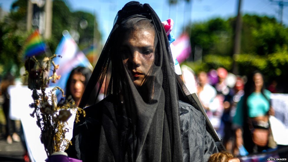 A transgender woman taking part in a march for LGBT rights in San Salvador