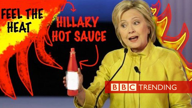 Hillary Clinton and a bottle of hot sauce