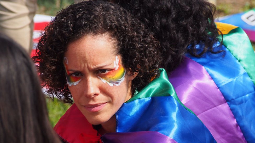 Woman with an LGBT flag