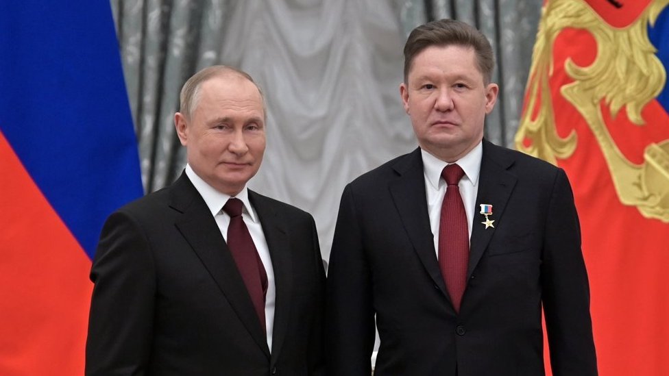 Alexey Miller (R) with Putin at the Kremlin on 2 February