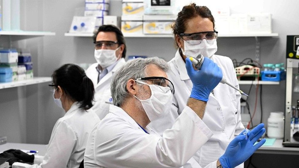 Technicians research Covid-19 at a lab in Buenos Aires, Argentina;