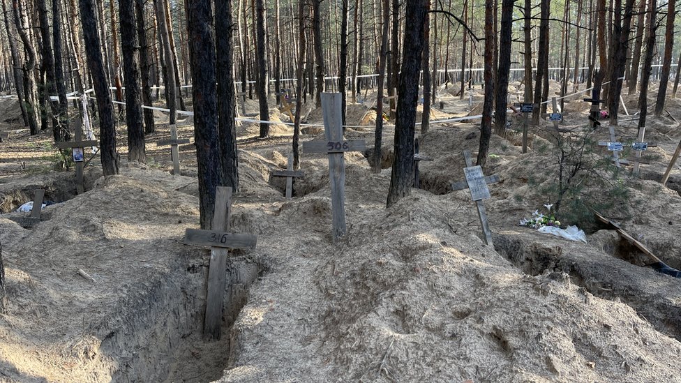Crosses of people buried near Izyum