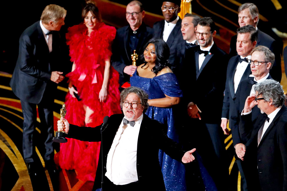 Green Book producer Charles Wessler on stage with cast and crew