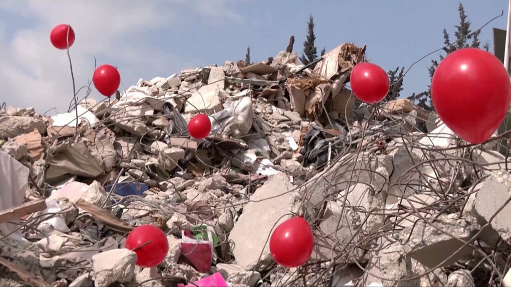 Turkey earthquake: Red balloons placed on rubble to honour child victims