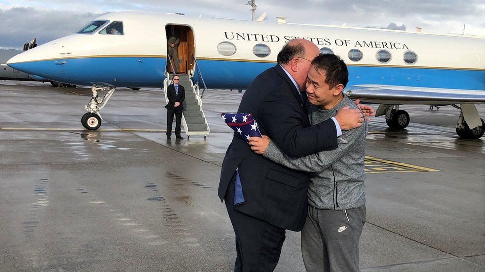 Xiyue Wan (right), who was held in Iran for three years, was greeted by US Ambassador to Switzerland Edward McMullen