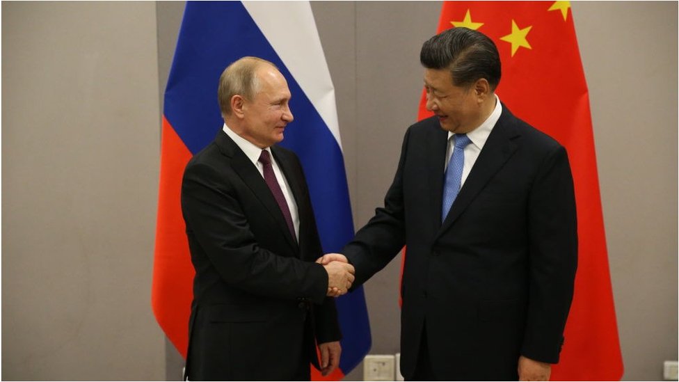 Russian President Vladimir Putin (L) greets Chinese President Xi Jinping (R) during their bilateral meeting on November 13, 2019 in Brasilia, Brazil. The leaders of Russia, China, Brazil, India and South Africa have gathered in Brasilia for the BRICS leaders summit.