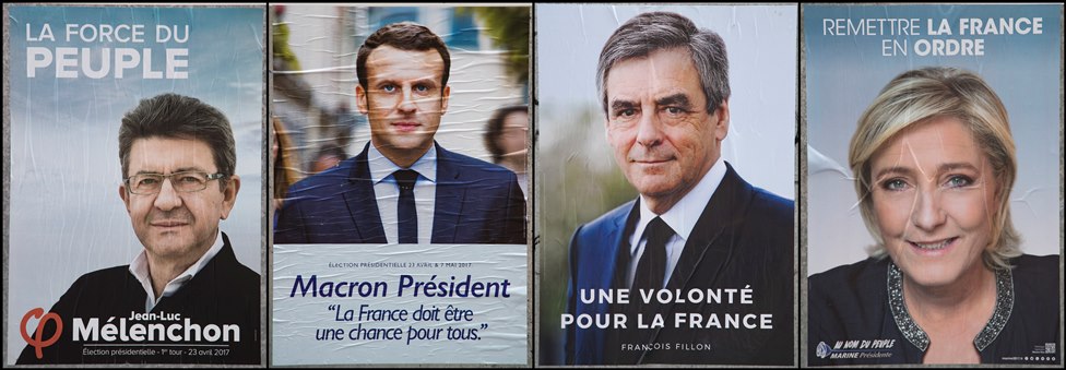 Los candidatos punteros en las elecciones, de izquierda a derecha, son: Jean-Luc Melenchon, Emmanuel Macron, Francois Fillon, y Marine Le Pen. Carteles de los candidatos punteros en Francia