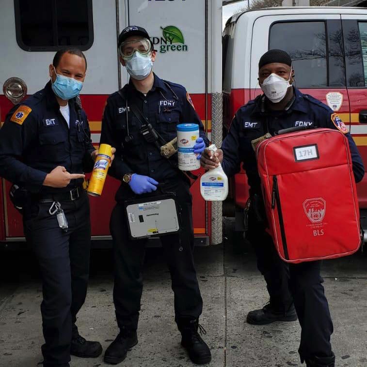 NYC paramedics with cleaning equipment