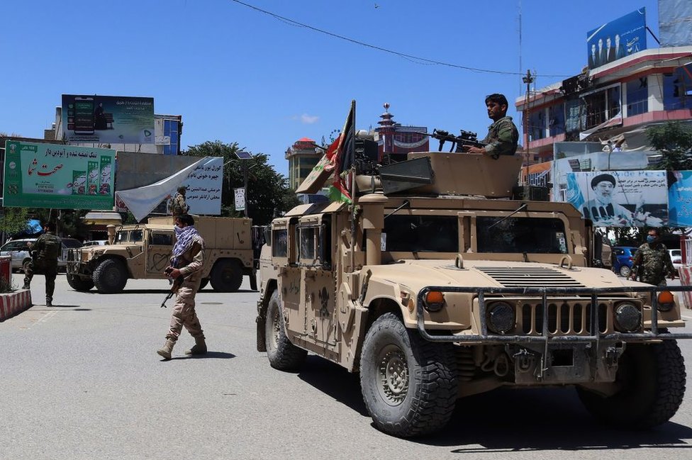 Afghan security forces sit in a Humvee vehicle amid ongoing fighting between Taliban militants and Afghan security forces in Kunduz on May 19, 2020