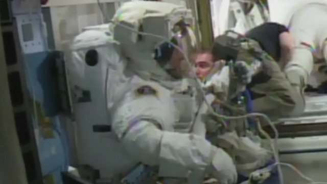 Tim Peake in his spacesuit ready to go in to the airlock