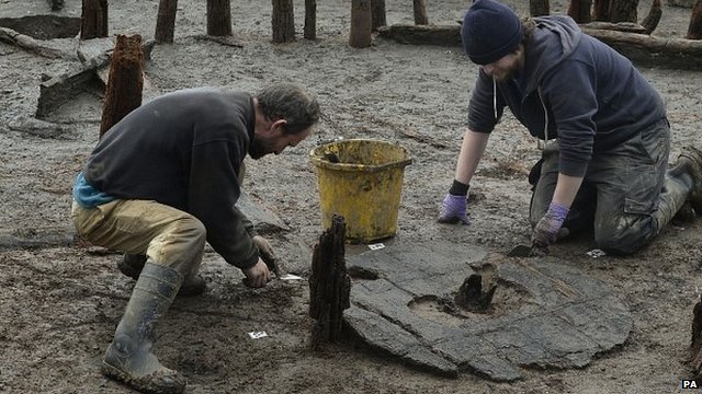 Bronze Age wheel being examined by archaeologists