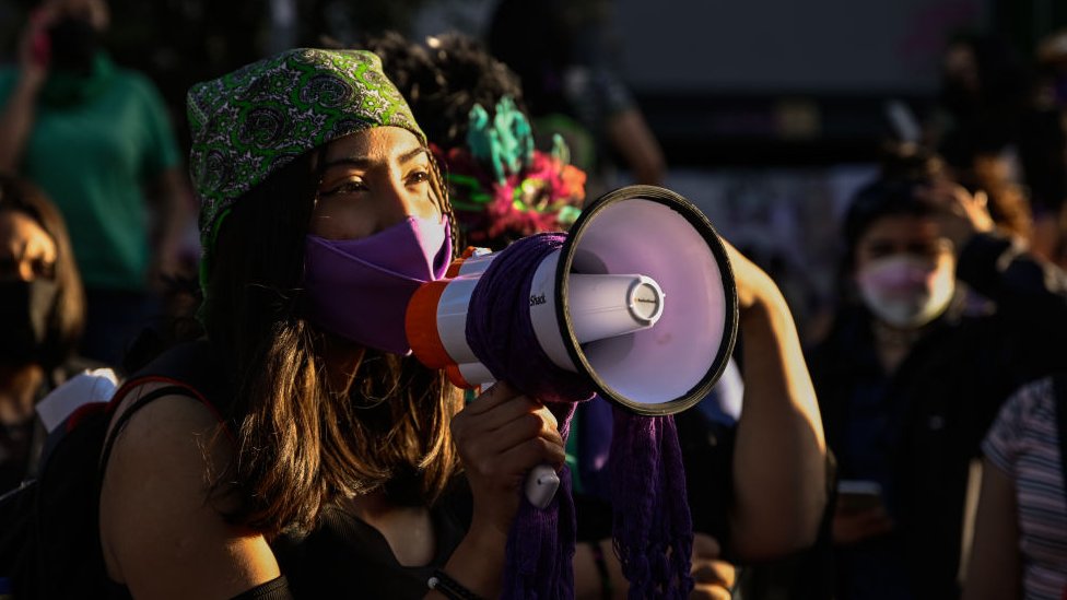 Woman talking into a megaphone