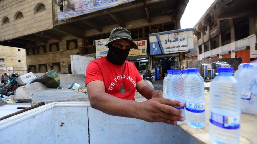 A man sells cold water in Baghdad