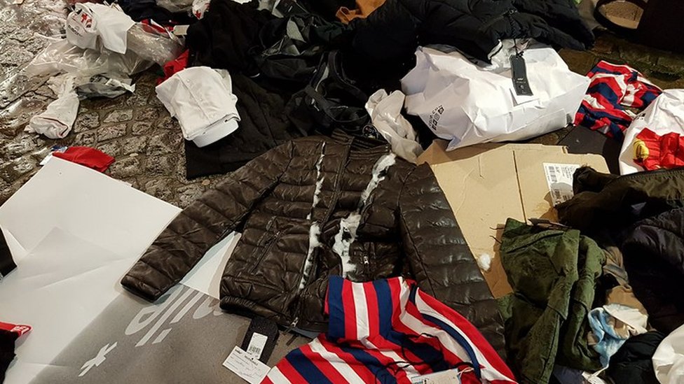 Shop criticised for tearing up unsold clothes during cold snap