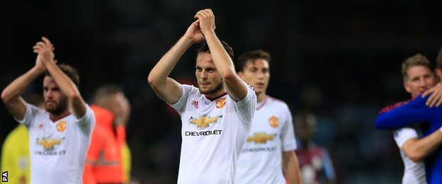 Daley Blind (centre) celebrates Manchester United's victory at Aston Villa