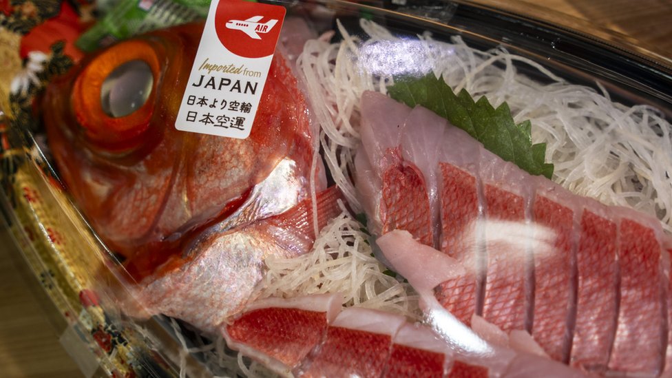 A label saying import from Japan on a box of raw fish inside a fridge at a supermarket on July 12, 2023 in Hong Kong, China. The head of Hong Kong Environmental Department said that if Japan releases nuclear waste waters into the sea, the city will ban seafood imports from 10 Japanese prefectures. (Photo by Vernon Yuen/NurPhoto via Getty Images)