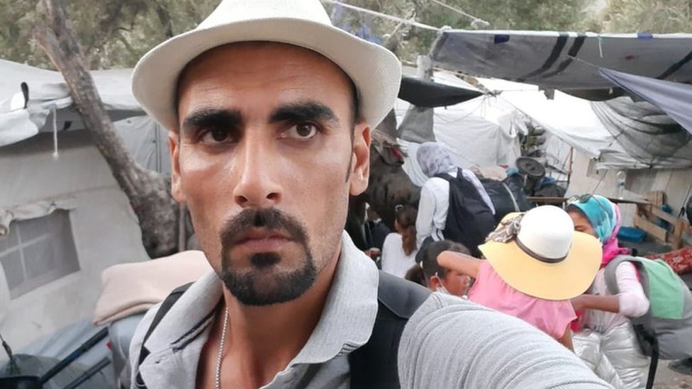 A selfie of Talibshah Hosseini beside his new bigger tent in Moria